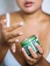 Woman Holding Green Labeled Can