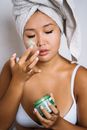 Woman in White Tank Top Holding Green Can