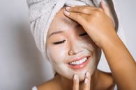 Woman With White Towel on Her Head