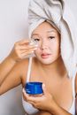 Woman in Blue Spaghetti Strap Top Holding Blue Plastic Cup