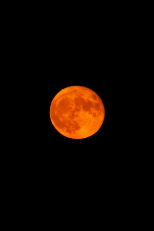 Red moon in black sky