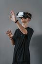 Man in Black Crew Neck T-shirt Wearing White and Black Vr Goggles