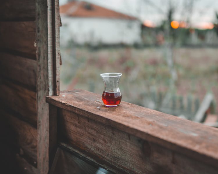 
A Cup Of Tea On A Wooden Ledge