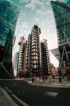 Fisheye capture of futuristic skyscrapers in the urban landscape of London with a modern architectural design.