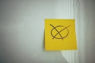 Yellow Paper Note on White Surface