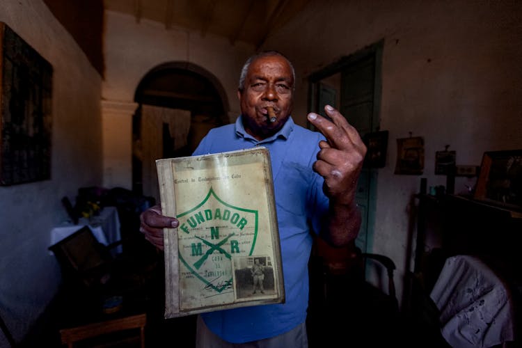 Old Ethnic Man With Cigar And Profile