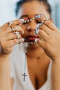 A Woman Holding a Prayer Beads