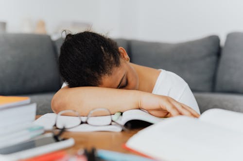 Free A Woman Sleeping on the Table Stock Photo