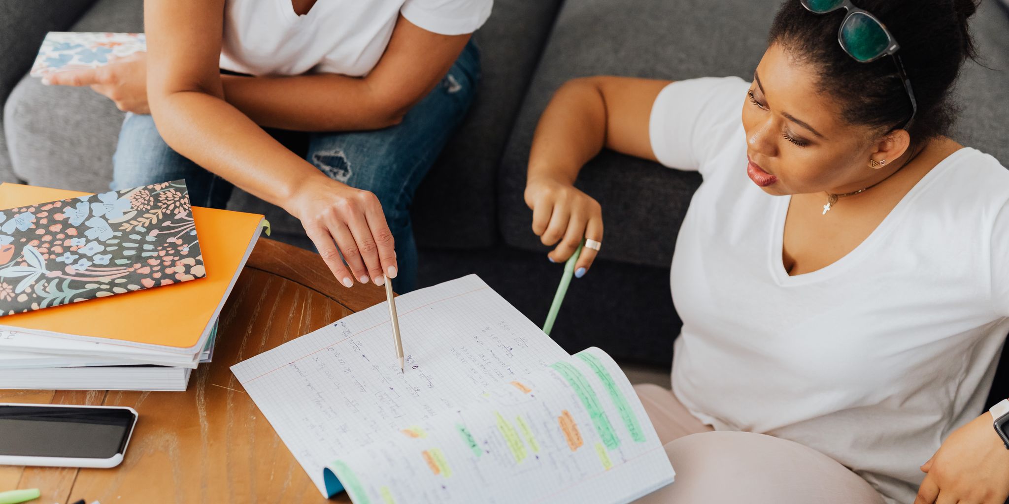 Tutor helping a student with schoolwork