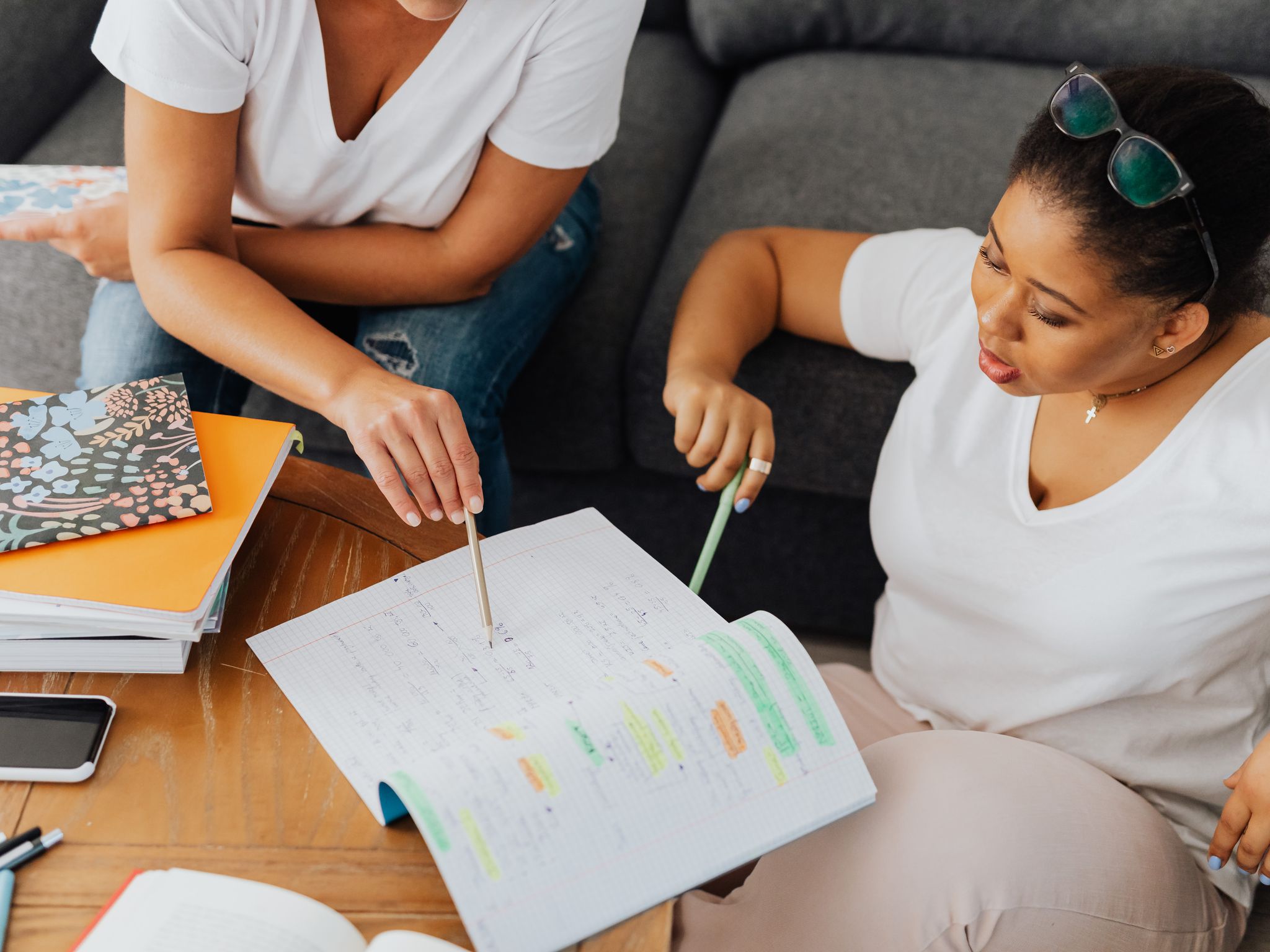 Tutor helping a student with schoolwork