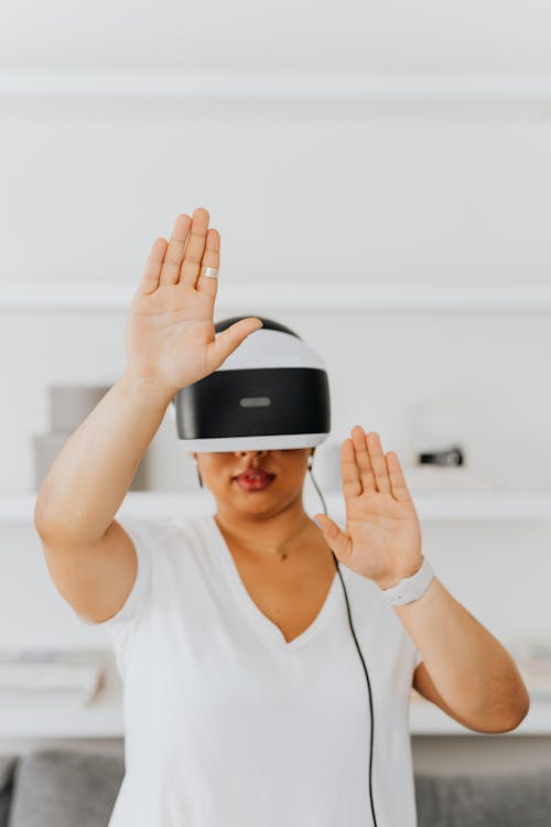 A Person in White Shirt Wearing a Vr Goggles
