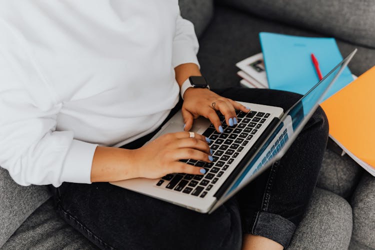 Close-Up Shot Of A Person Using A Laptop