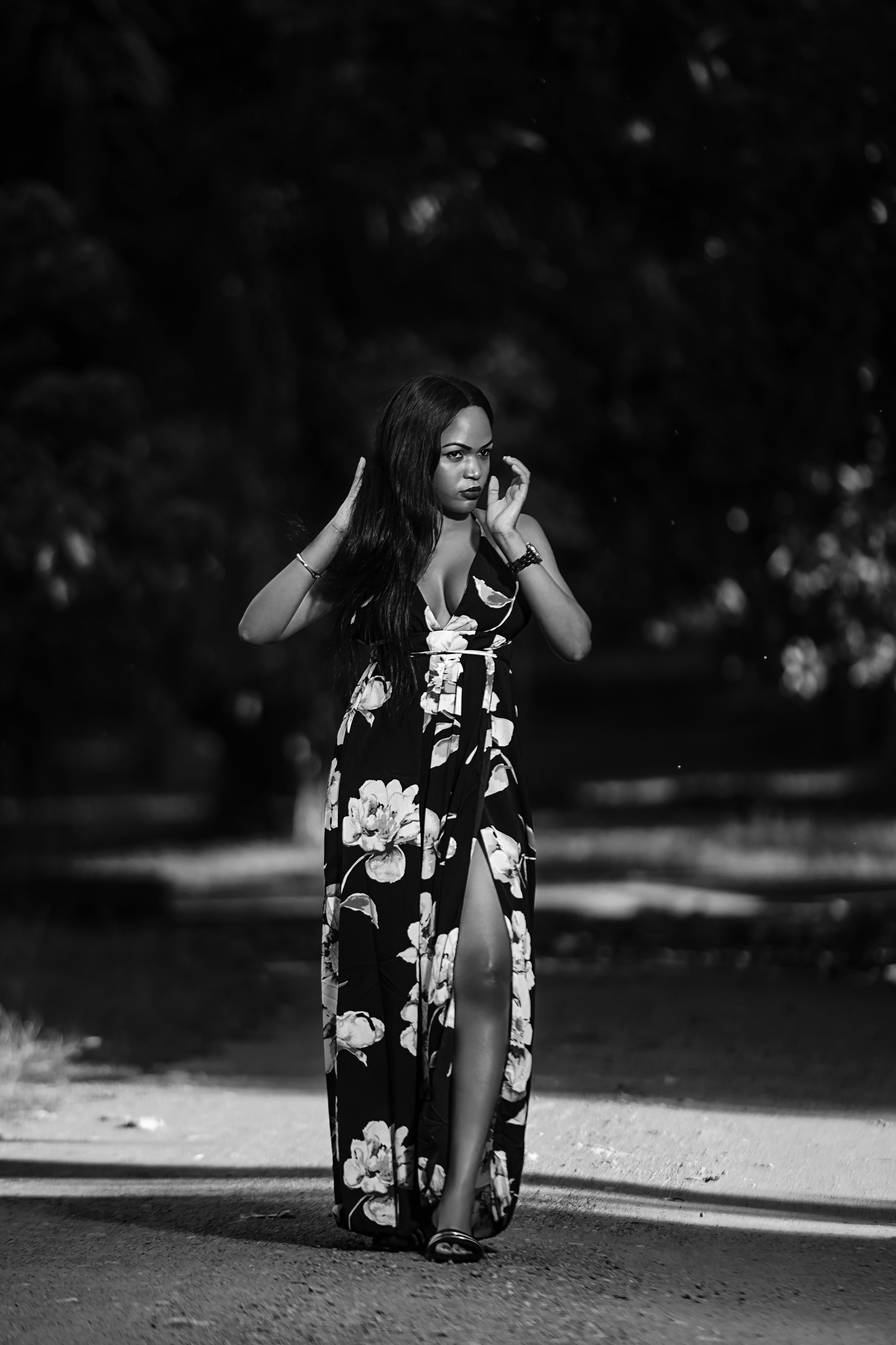 Elegant black woman in long dress walking in park · Free Stock Photo