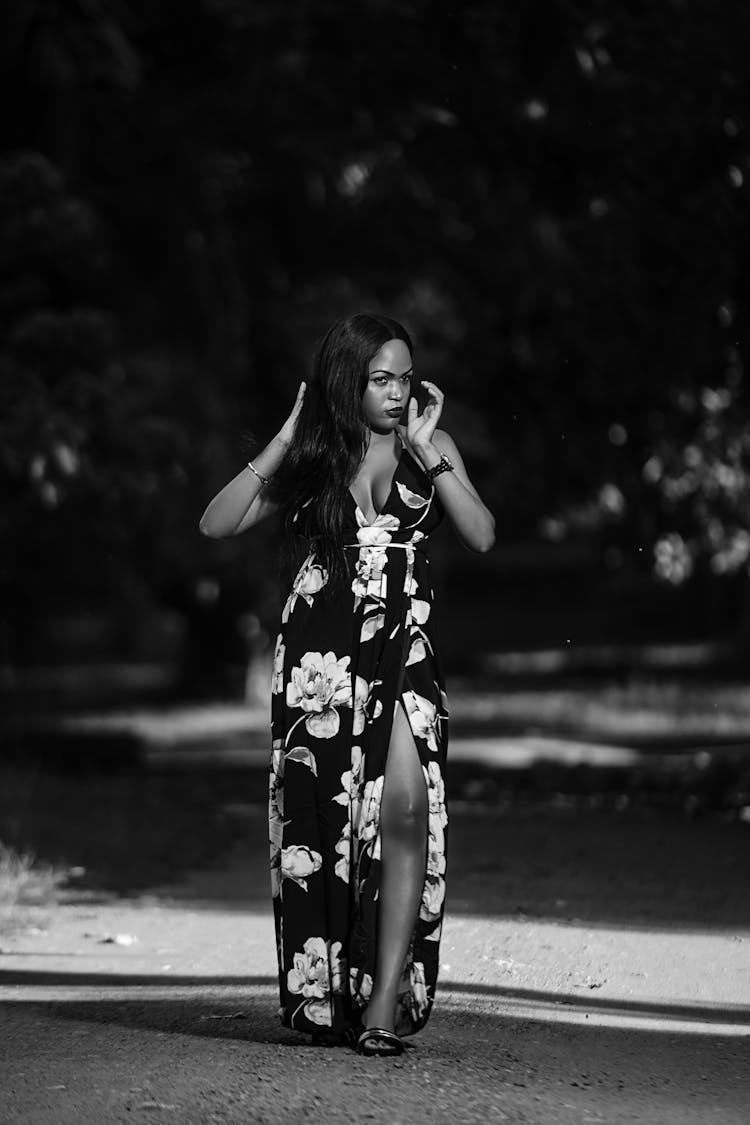 Elegant Black Woman In Long Dress Walking In Park