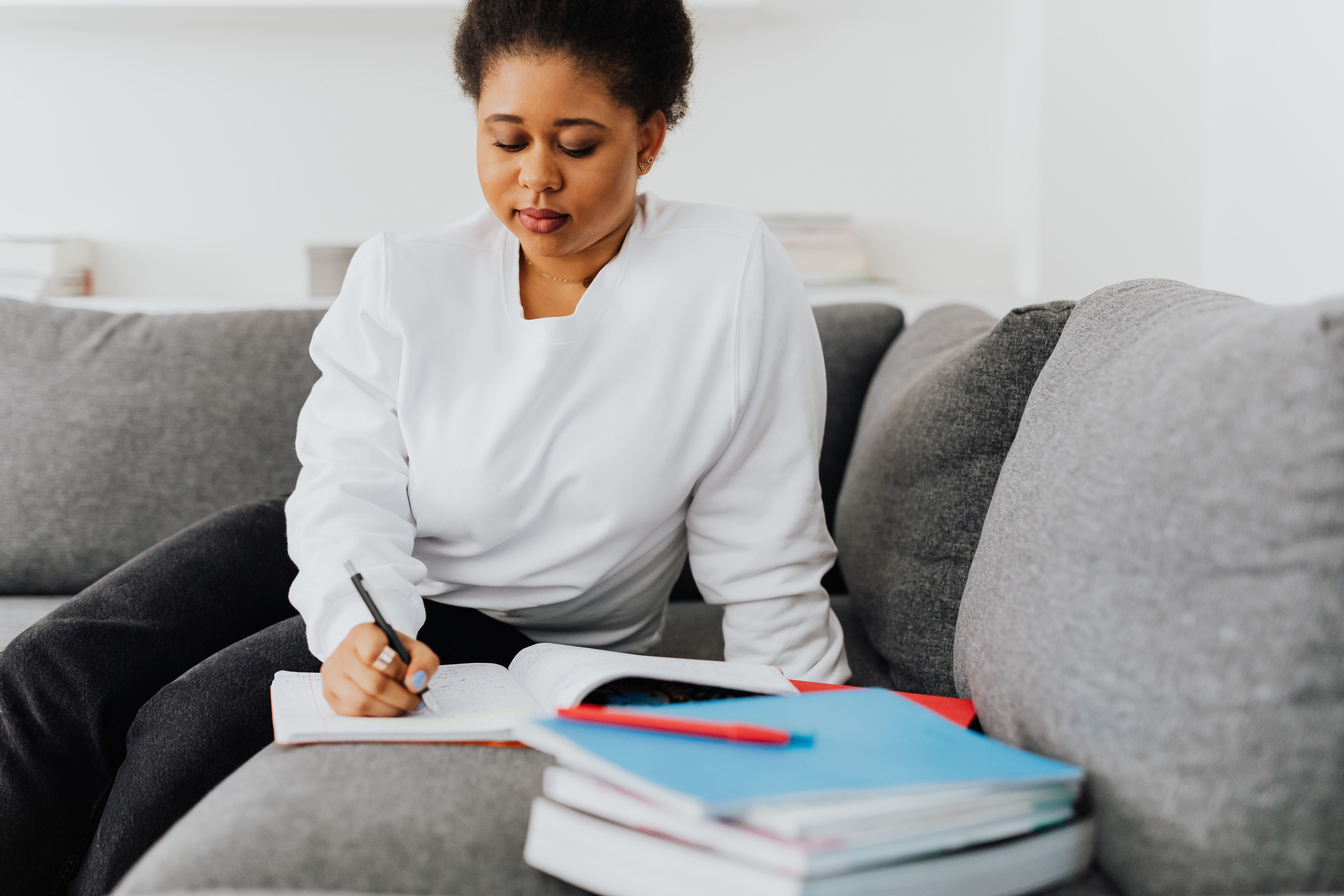 Woman In White Top Writing · Free Stock Photo
