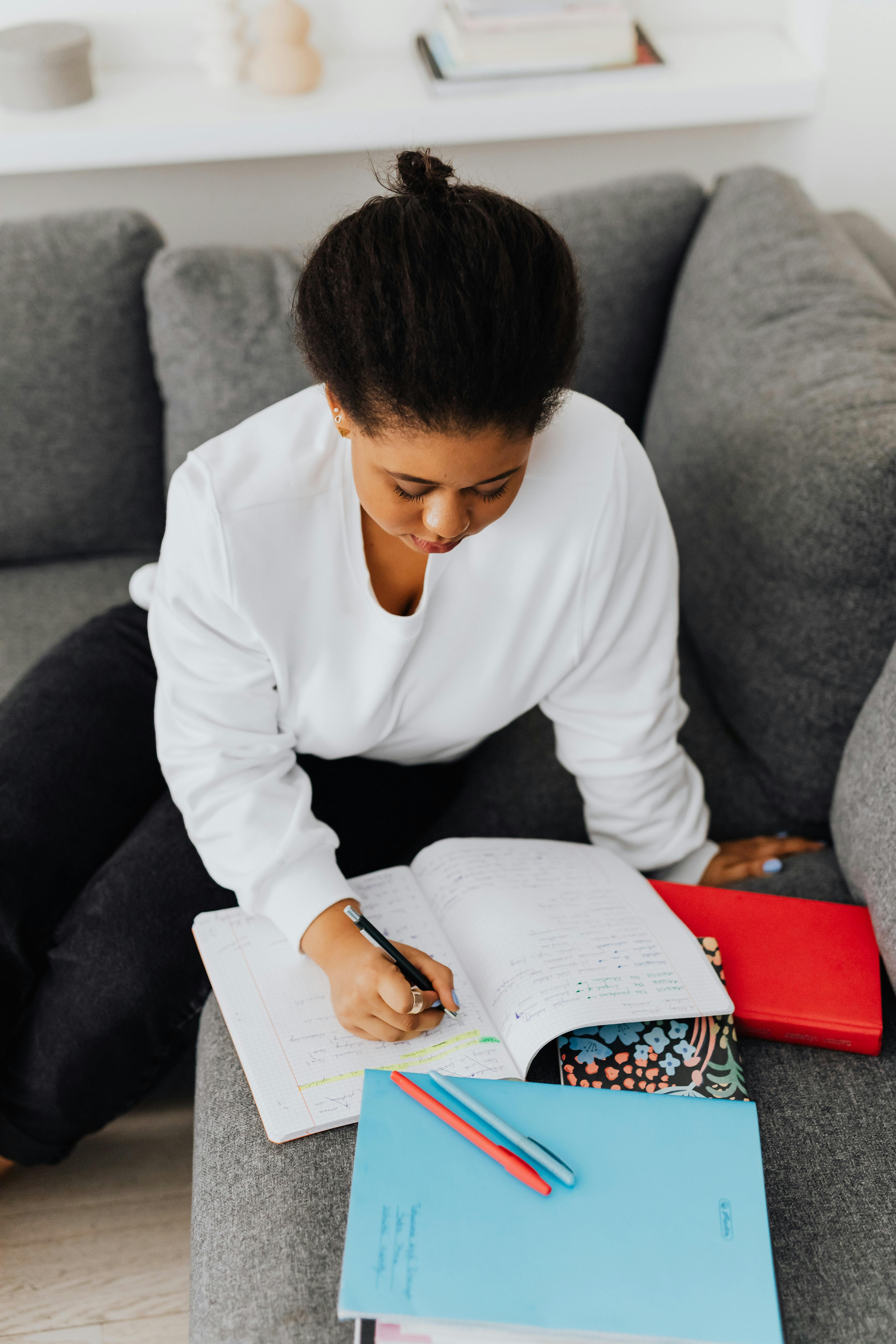 overhead shot of a woman doing her homework