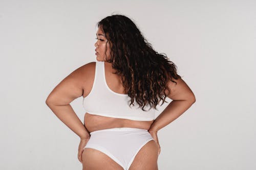 Overweight woman with long hair in underwear