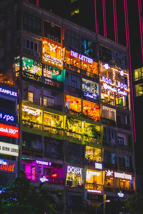 Balconies Illuminated by Neon Signs