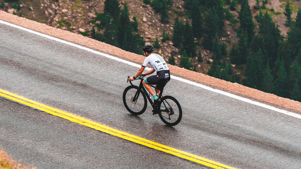Cyclist riding along a mountain road