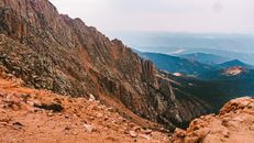 Brown Rocky Mountain Under White Sky
