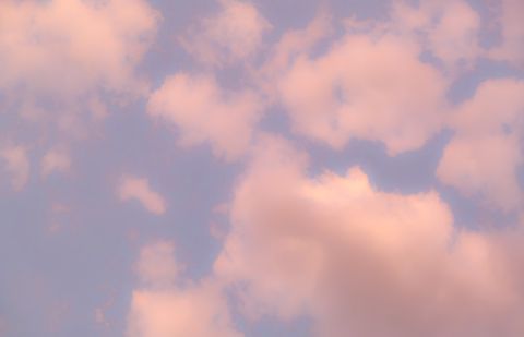 Soft pink clouds drifting in a pale evening sky — Magda Ehlers on Pexels