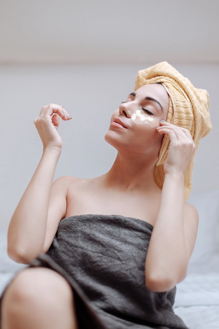 A Woman Using Under Eye Patch