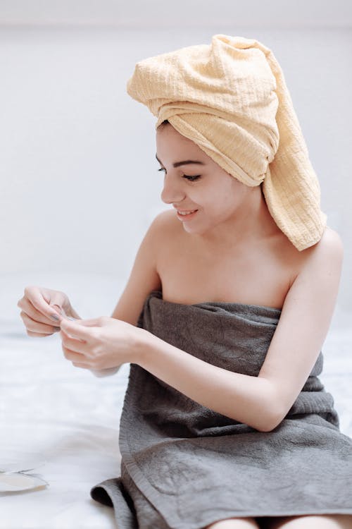 A Woman with Yellow Towel on  her Head