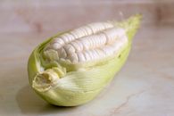 Yellow and Green Corn on Brown Wooden Table