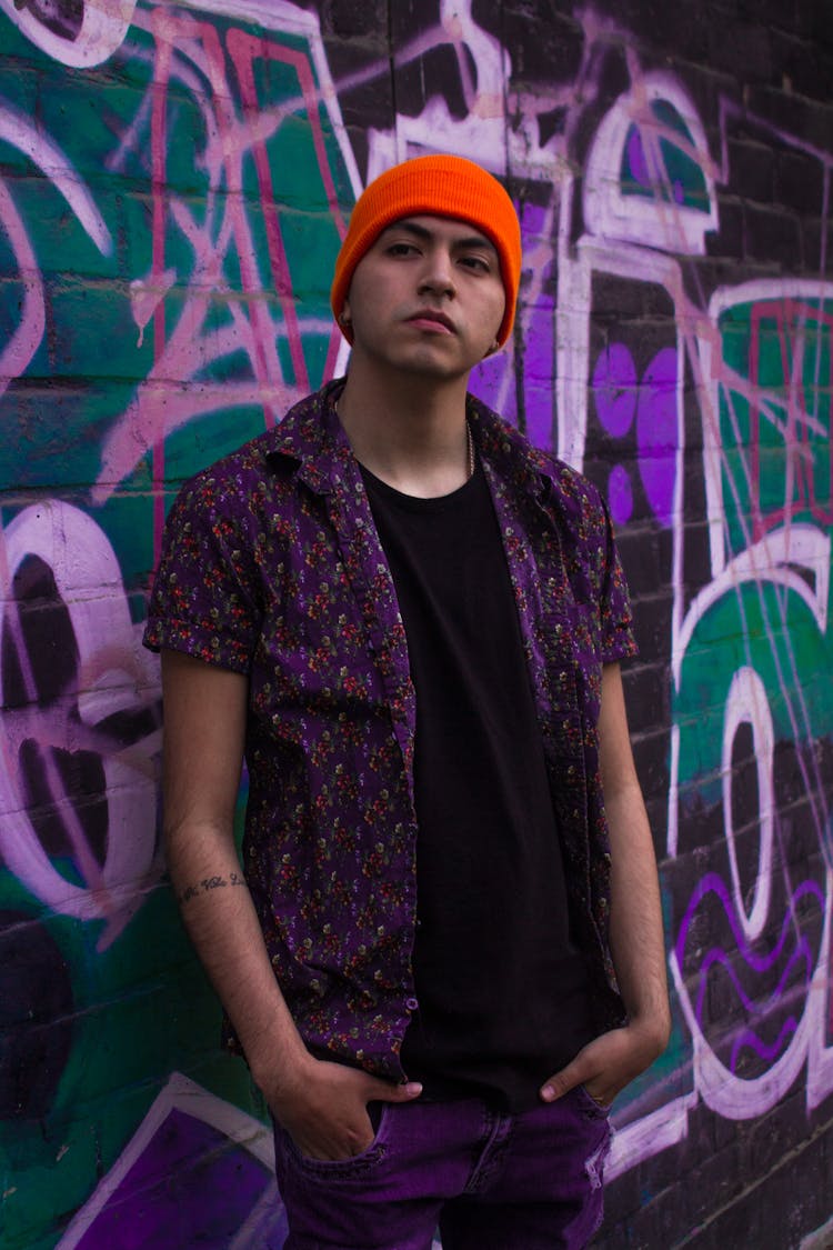 Man Posing On Graffiti Wall Background