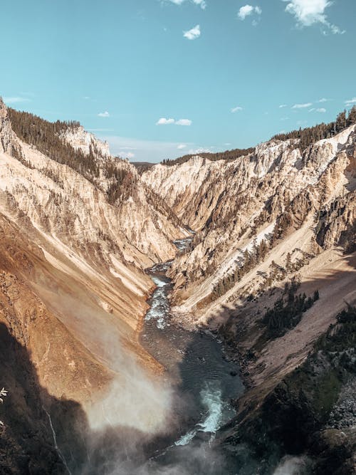 Breathtaking scenery of wild river flowing through rough rocky mountains in Grand Canyon of Yellowstone National Park