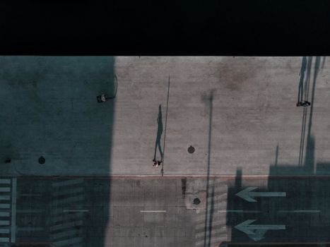 Aerial shot showing long shadows on a sidewalk in Veracruz, Mexico.