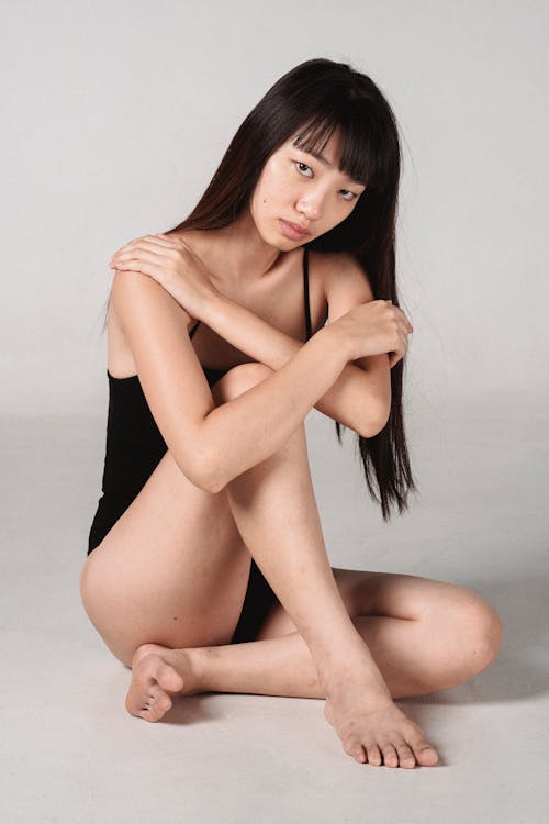 Free Sensual Asian woman resting in studio Stock Photo