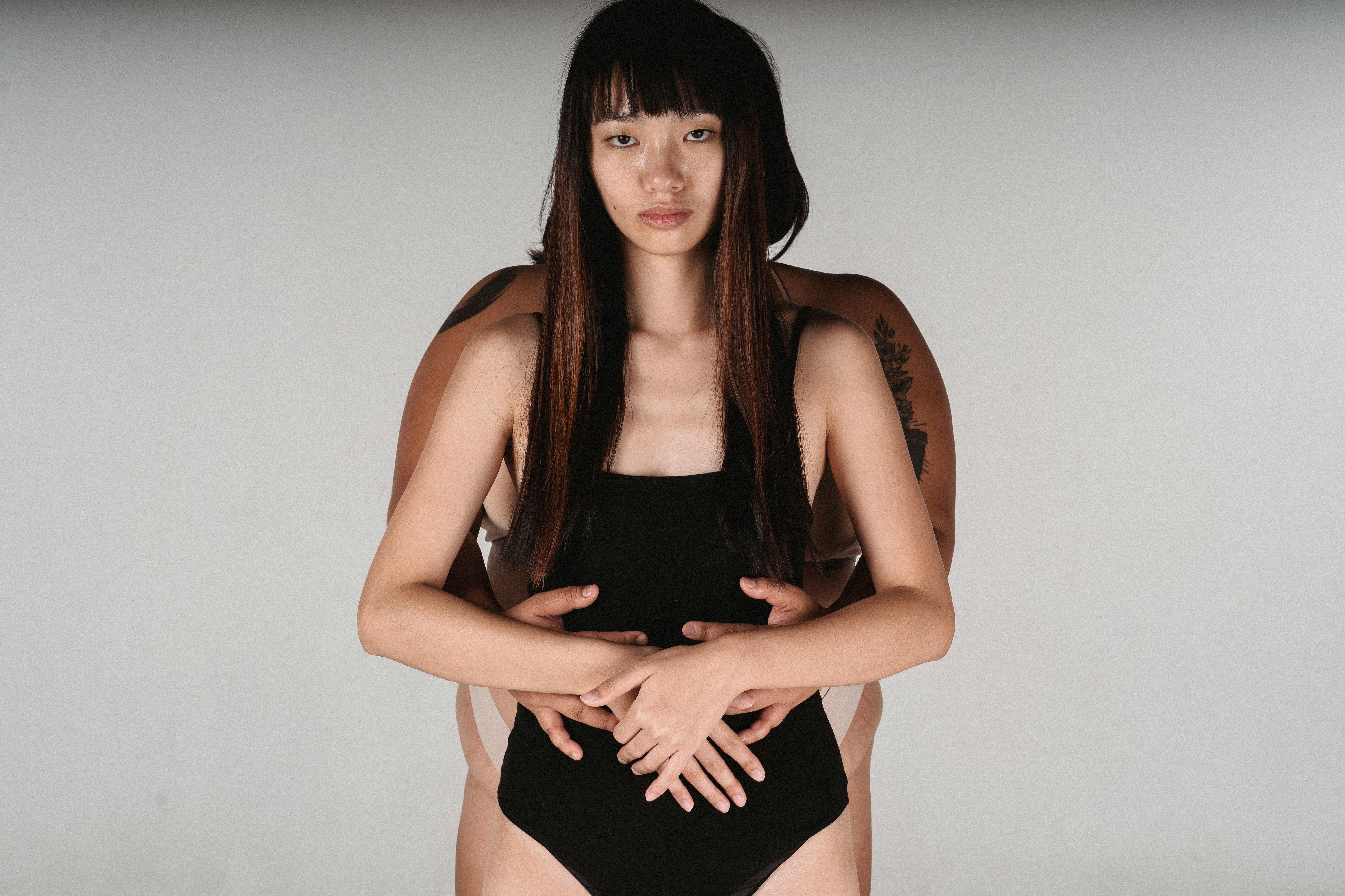 Alluring Asian women in underwear hugging · Free Stock Photo