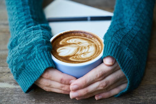 Free Person Holding Cup of Coffee Stock Photo