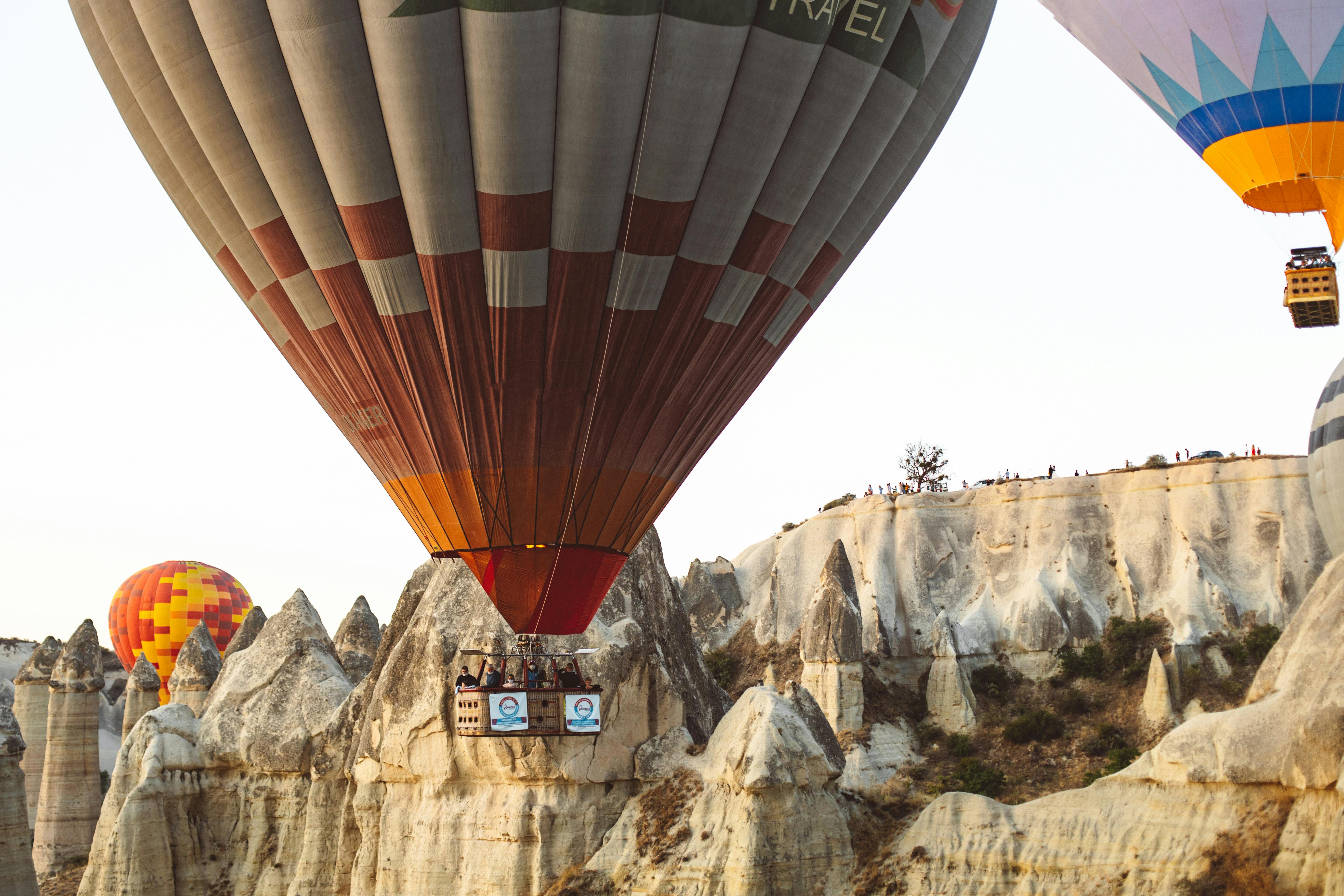 Hot Air Balloons Flying over Mountains