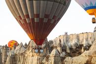 Hot Air Balloons Flying over Mountains