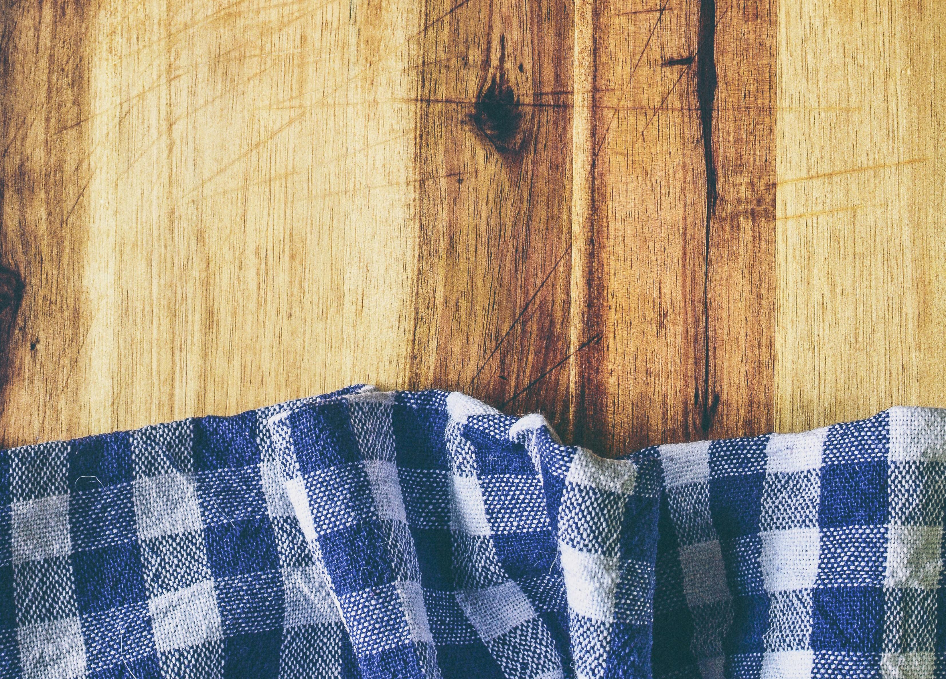 Empty wooden deck table and red checked tablecloth over mint wallpaper  background Stock Photo | Adobe Stock