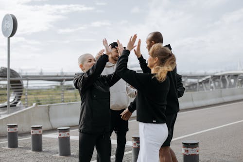 Free Group of People Doing High Five Stock Photo
