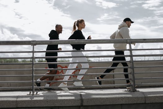 Three people jogging on a bridge, representing a healthy lifestyle outdoors.