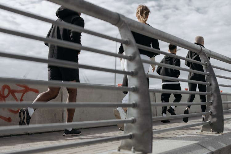 Back View Shot Of People Jogging Together