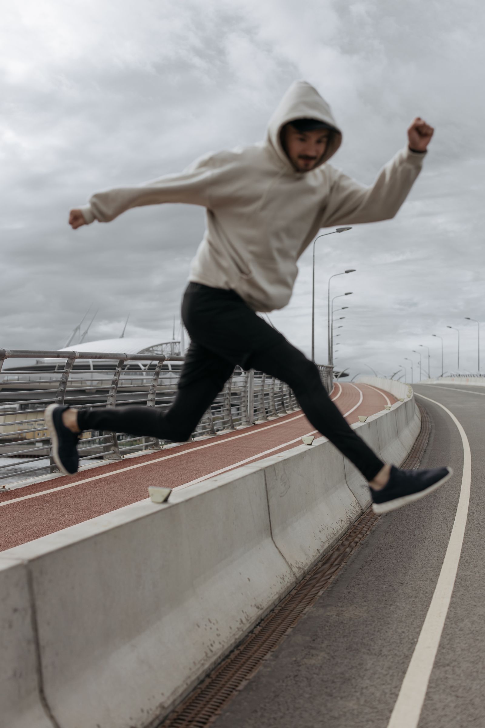 Runner tying shoes before activity with ankle support considerations