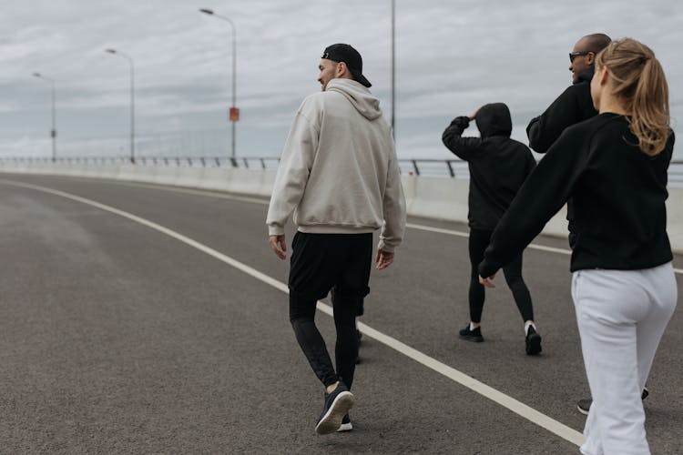 A People Walking On The Road 