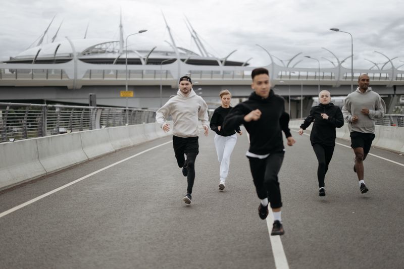 Group of adults running together for Zone 2 cardio training