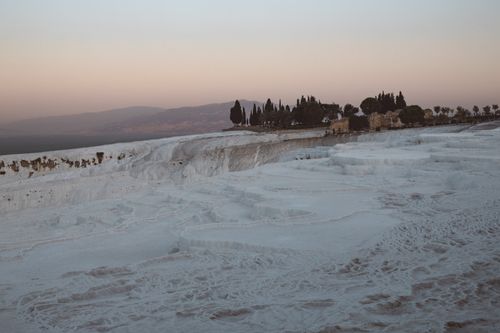 Free Breathtaking landscape of Pamukkale's cotton-like terraces during sunset in Turkey. Stock Photo