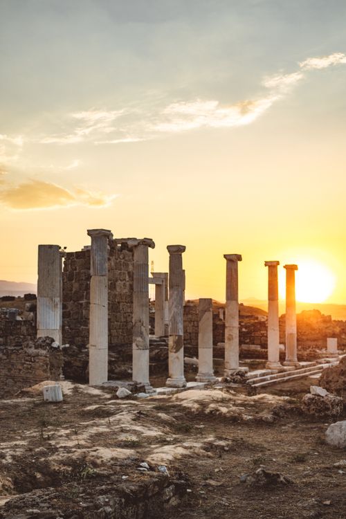 Free Stunning view of ancient ruins with stone columns at sunrise in Pamukkale, Turkey. Stock Photo