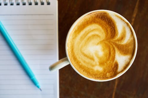 Free Cappuccino Beside Paper Stock Photo