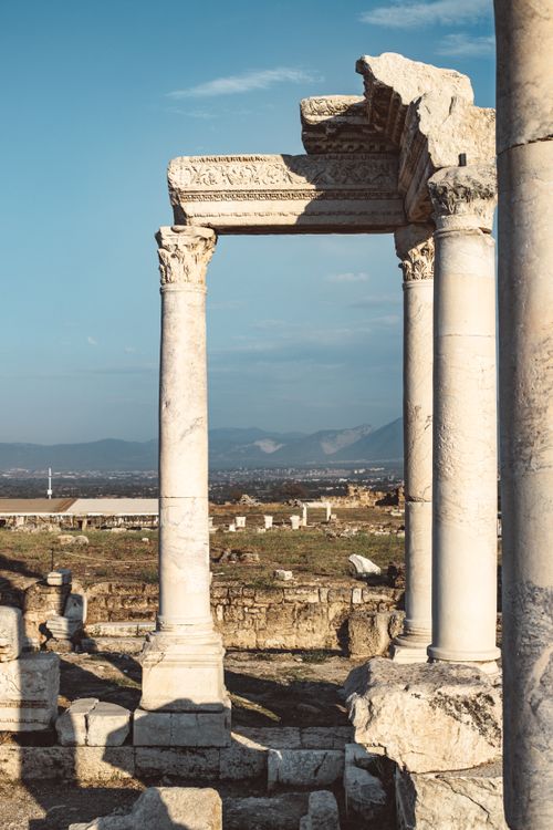 Free Explore the historic ruins of Laodicea with striking Corinthian columns under a clear blue sky. Stock Photo