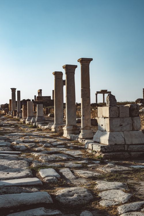 Free Explore ancient Roman ruins with towering stone columns under a clear sky. Stock Photo