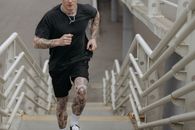 A Man Running on Concrete Stairs