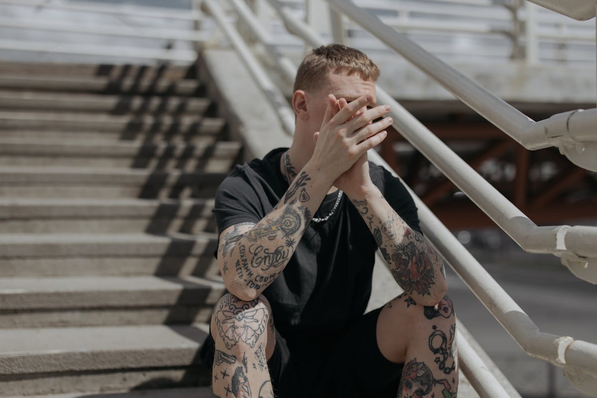 Pink ribbon symbolizing breast cancer awareness pinned to clothes